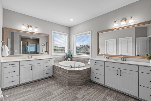 200 Baskerville Ct, Holly Springs, NC 27540 - full bathroom with two vanities, a stall shower, and a garden tub