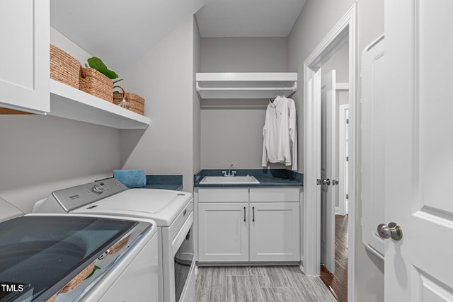 200 Baskerville Ct, Holly Springs, NC 27540 - washroom featuring washer and dryer, cabinet space, and wood finish floors