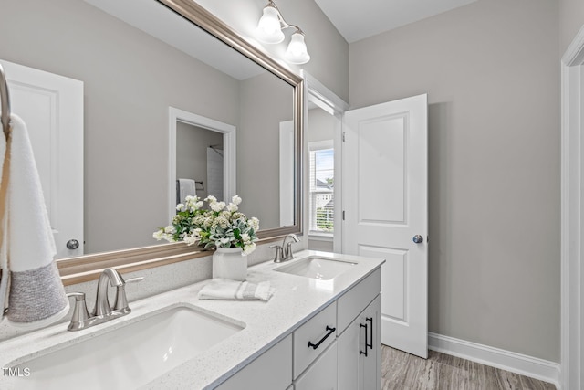 200 Baskerville Ct, Holly Springs, NC 27540 - bathroom featuring double vanity and wood finished floors