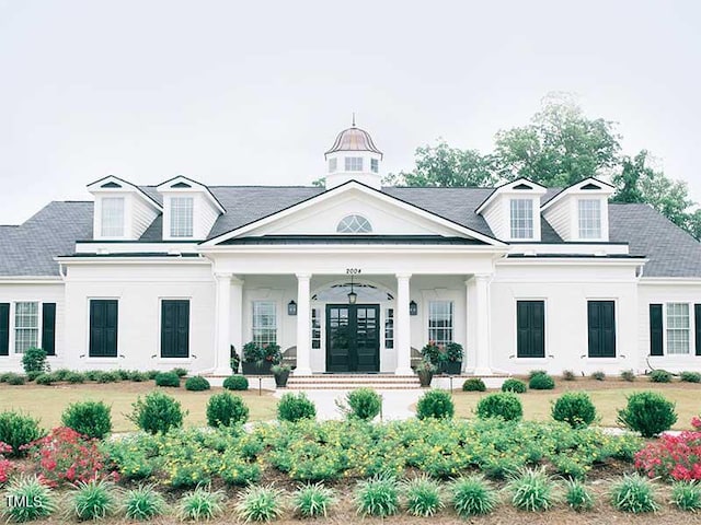 200 Baskerville Ct, Holly Springs, NC 27540 - view of front facade featuring french doors, a porch, and stucco siding