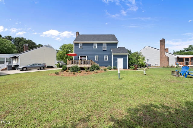 6 W Canterbury Ct, Wendell, NC 27591 - rear view of property with a wooden deck, a yard, and a chimney