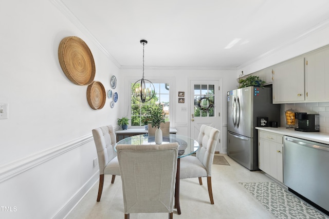 6 W Canterbury Ct, Wendell, NC 27591 - dining room with crown molding, a chandelier, and baseboards