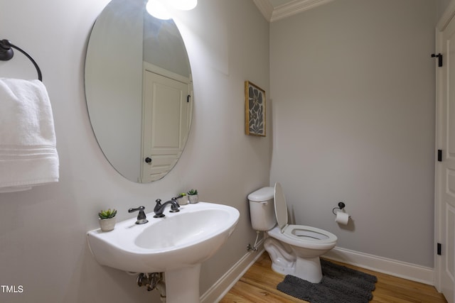 441 Heritage Village Ln, Apex, NC 27502 - bathroom with wood finished floors, crown molding, toilet, and baseboards