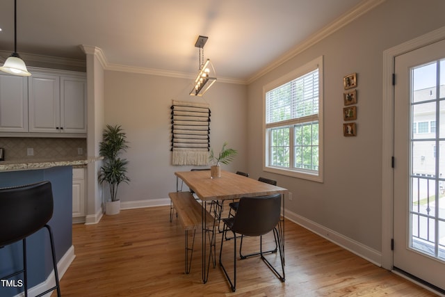 441 Heritage Village Ln, Apex, NC 27502 - dining space featuring light wood-type flooring, ornamental molding, and baseboards
