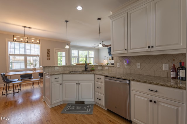 441 Heritage Village Ln, Apex, NC 27502 - kitchen with dishwasher, a sink, a peninsula, white cabinetry, and decorative backsplash