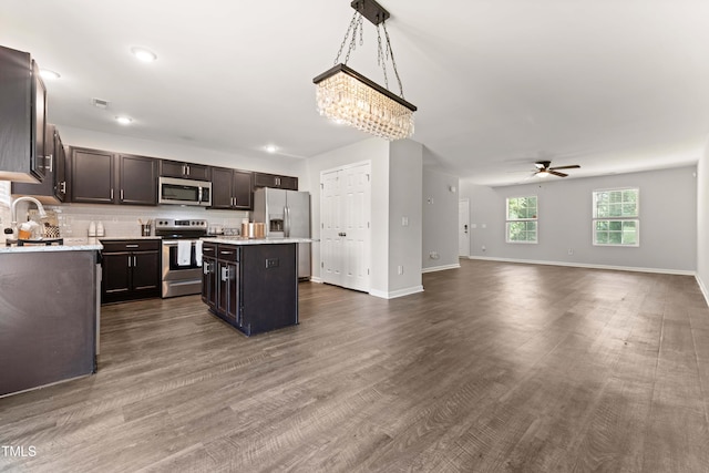 218 Mason Rd, Durham, NC 27712 - kitchen featuring appliances with stainless steel finishes, light countertops, a ceiling fan, a center island, and open floor plan