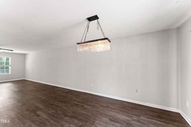218 Mason Rd, Durham, NC 27712 - empty room with dark wood-style flooring, a ceiling fan, and baseboards