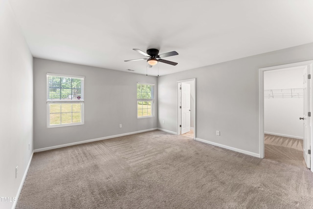 218 Mason Rd, Durham, NC 27712 - unfurnished bedroom featuring carpet flooring, baseboards, and a spacious closet