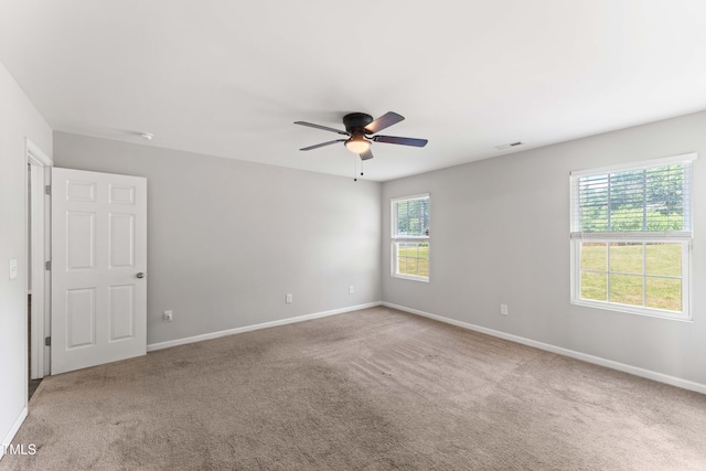 218 Mason Rd, Durham, NC 27712 - carpeted spare room featuring a ceiling fan and baseboards