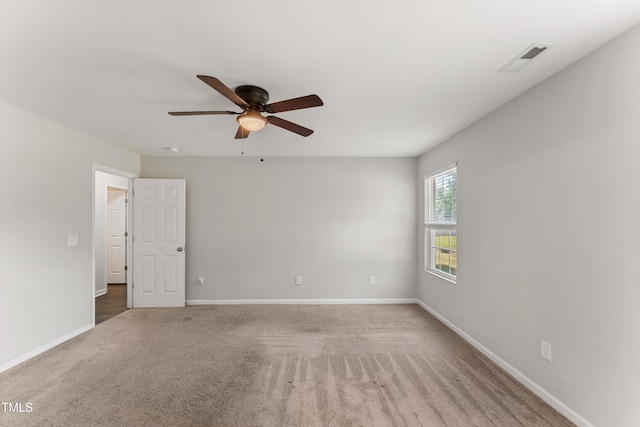 218 Mason Rd, Durham, NC 27712 - spare room with a ceiling fan, carpet flooring, and baseboards