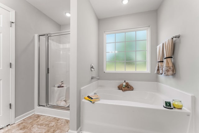 218 Mason Rd, Durham, NC 27712 - full bathroom featuring a garden tub, a shower stall, and recessed lighting