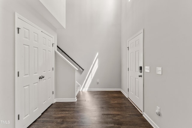 218 Mason Rd, Durham, NC 27712 - entrance foyer with stairs, dark wood-style floors, a towering ceiling, and baseboards