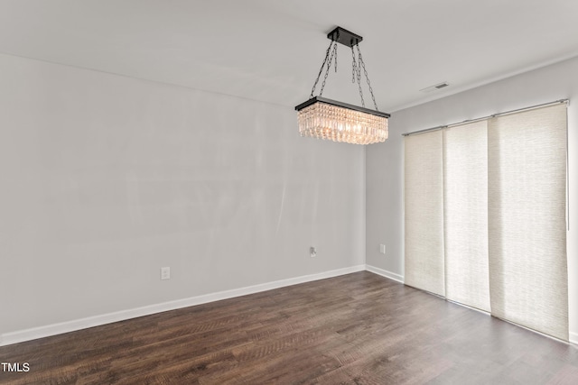 218 Mason Rd, Durham, NC 27712 - unfurnished dining area with a chandelier, dark wood-style floors, and baseboards