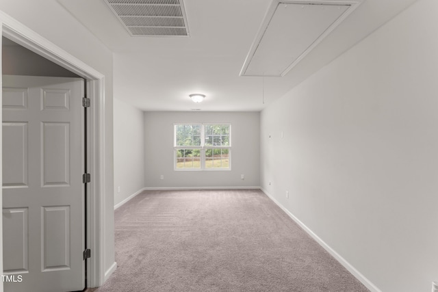 218 Mason Rd, Durham, NC 27712 - carpeted empty room with attic access and baseboards