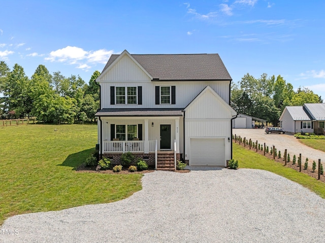 412 Carr Store Rd, Cedar Grove, NC 27231 - modern inspired farmhouse featuring a porch, gravel driveway, a front yard, and a garage