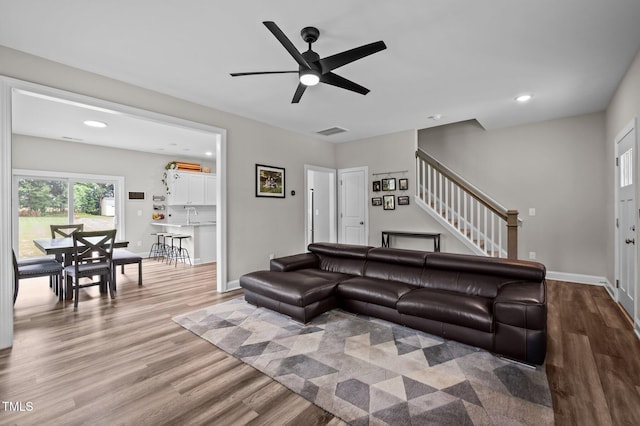 412 Carr Store Rd, Cedar Grove, NC 27231 - living area with wood finished floors, a ceiling fan, stairway, baseboards, and recessed lighting