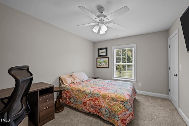 412 Carr Store Rd, Cedar Grove, NC 27231 - bedroom with light carpet, baseboards, and a ceiling fan