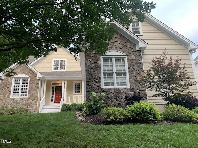 1012 Coram Fields Rd, Wake Forest, NC 27587 - view of front of property with stone siding and a front yard
