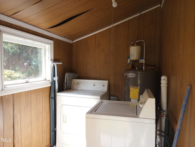 912 Dixie Trl, Raleigh, NC 27607 - laundry area with washer and dryer, electric water heater, wood walls, and wooden ceiling