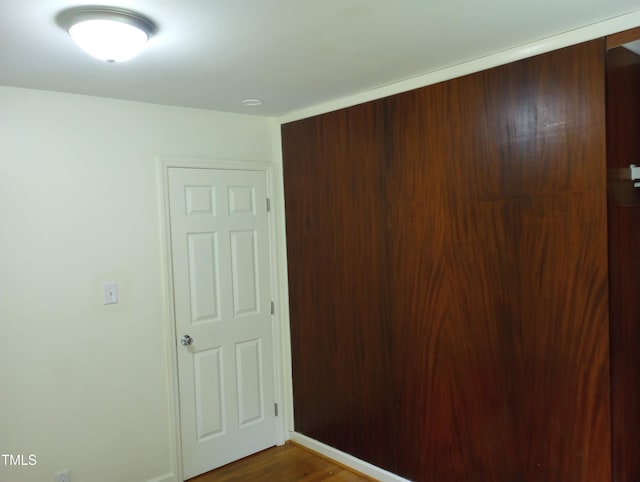 912 Dixie Trl, Raleigh, NC 27607 - unfurnished bedroom featuring dark wood finished floors and baseboards