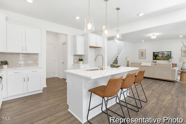 105 Mable Ct Unit 10, Lillington, NC 27546 - kitchen featuring a sink, open floor plan, dark wood-style floors, white cabinetry, and recessed lighting