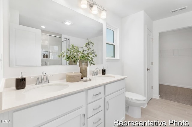 105 Mable Ct Unit 10, Lillington, NC 27546 - full bath with a shower stall, toilet, double vanity, and tile patterned flooring