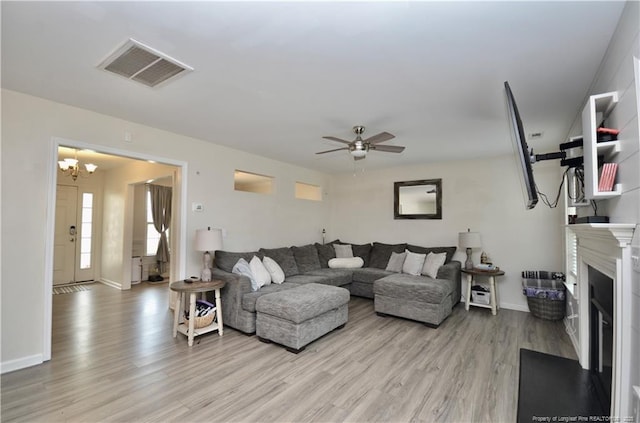 109 Red Coat Dr, Cameron, NC 28326 - living room featuring light wood-type flooring, a chandelier, and baseboards