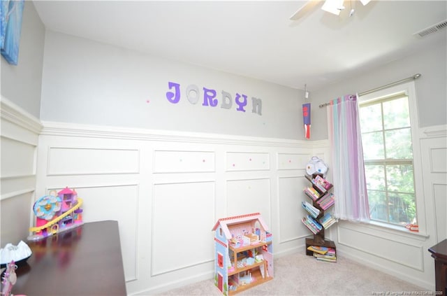 109 Red Coat Dr, Cameron, NC 28326 - playroom featuring a decorative wall, carpet flooring, a ceiling fan, and wainscoting