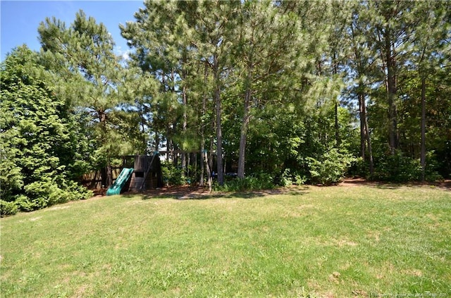 109 Red Coat Dr, Cameron, NC 28326 - view of green lawn featuring a playground