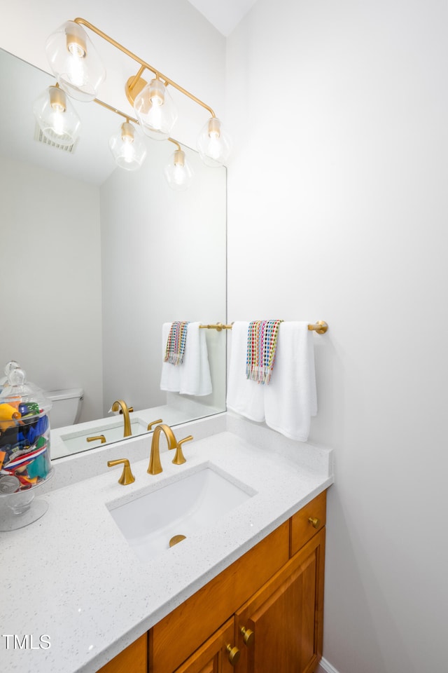574 Chatham Dr, Chapel Hill, NC 27516 - half bathroom featuring vanity and toilet