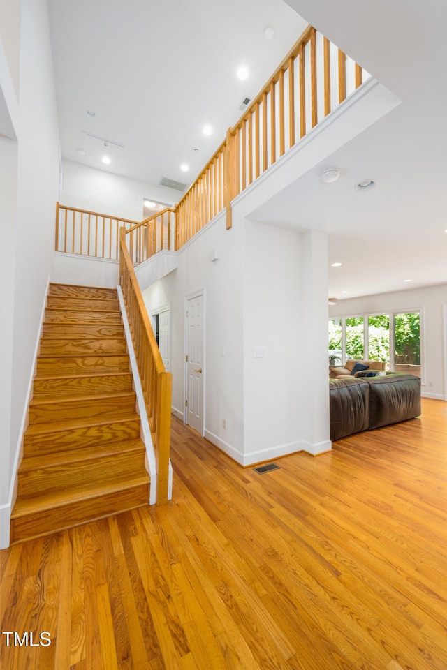 574 Chatham Dr, Chapel Hill, NC 27516 - stairs featuring wood finished floors, baseboards, and recessed lighting