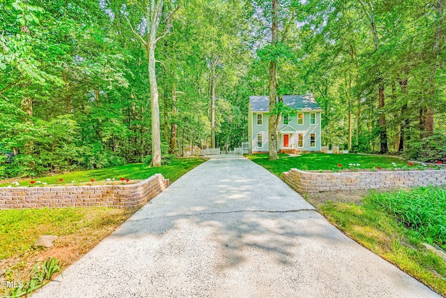 114 Bonaparte Dr, Hillsborough, NC 27278 - colonial-style house featuring a front lawn and a view of trees