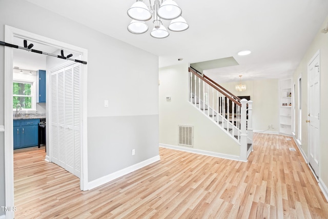 114 Bonaparte Dr, Hillsborough, NC 27278 - entrance foyer with a chandelier, stairway, light wood-style flooring, baseboards, and recessed lighting