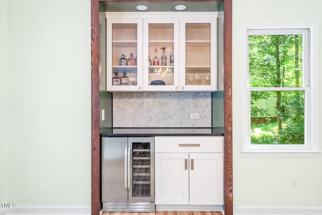 114 Bonaparte Dr, Hillsborough, NC 27278 - indoor dry bar with beverage cooler, tasteful backsplash, and baseboards