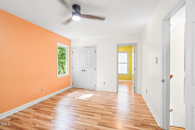 114 Bonaparte Dr, Hillsborough, NC 27278 - unfurnished bedroom with light wood finished floors, baseboards, a closet, and ceiling fan