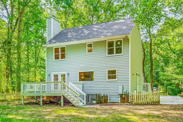 114 Bonaparte Dr, Hillsborough, NC 27278 - back of property with a wooden deck, a chimney, and a shingled roof