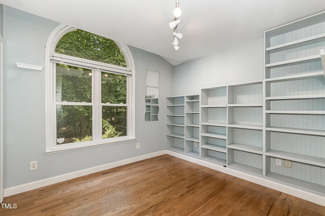 2805 Evans St, Durham, NC 27705 - unfurnished room with baseboards, wood finished floors, and rail lighting
