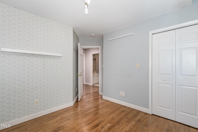 2805 Evans St, Durham, NC 27705 - corridor with baseboards, wood finished floors, and wallpapered walls
