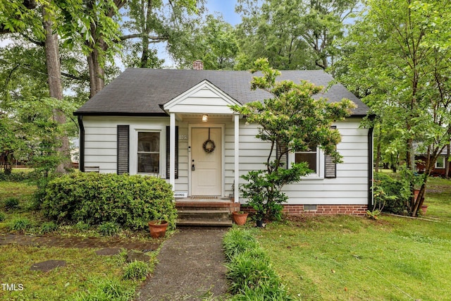 1105 Hawthorne Ln, Burlington, NC 27215 - view of front of house featuring a front yard, a shingled roof, and crawl space