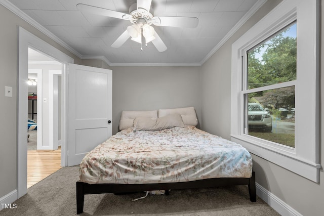 1105 Hawthorne Ln, Burlington, NC 27215 - bedroom with light carpet, ornamental molding, baseboards, and ceiling fan