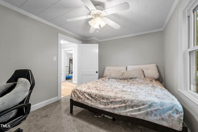 1105 Hawthorne Ln, Burlington, NC 27215 - bedroom with carpet flooring, crown molding, ceiling fan, baseboards, and multiple windows