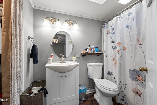 1105 Hawthorne Ln, Burlington, NC 27215 - full bathroom featuring toilet, vanity, wood finished floors, ornamental molding, and a shower with curtain