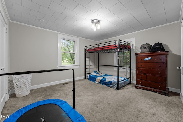 1105 Hawthorne Ln, Burlington, NC 27215 - carpeted bedroom with crown molding and baseboards