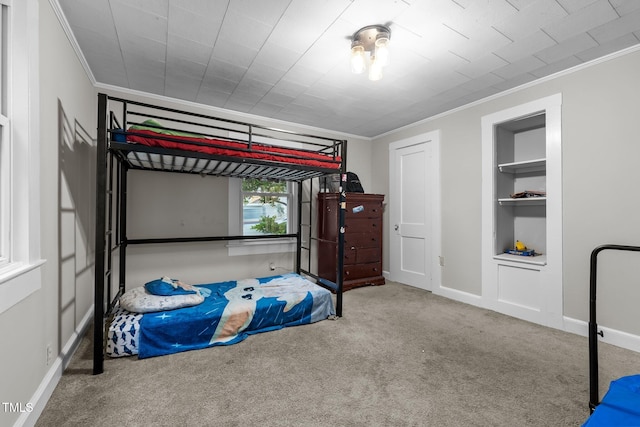 1105 Hawthorne Ln, Burlington, NC 27215 - bedroom featuring ornamental molding, carpet, and baseboards