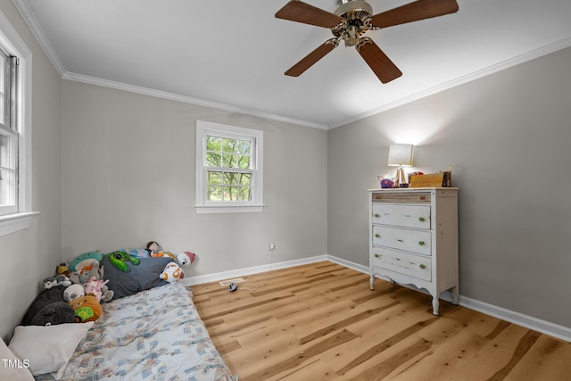 1105 Hawthorne Ln, Burlington, NC 27215 - bedroom with light wood-style flooring, crown molding, baseboards, and a ceiling fan