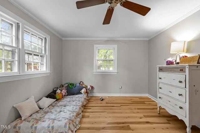 1105 Hawthorne Ln, Burlington, NC 27215 - bedroom with light wood finished floors, baseboards, ornamental molding, and ceiling fan