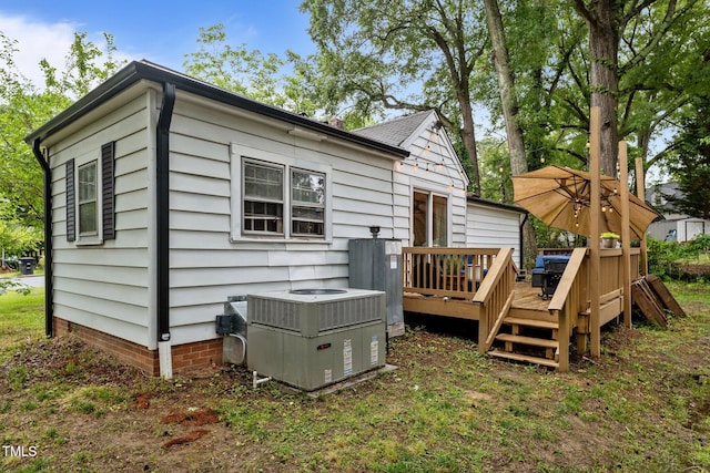 1105 Hawthorne Ln, Burlington, NC 27215 - rear view of house with central AC unit, a deck, and crawl space