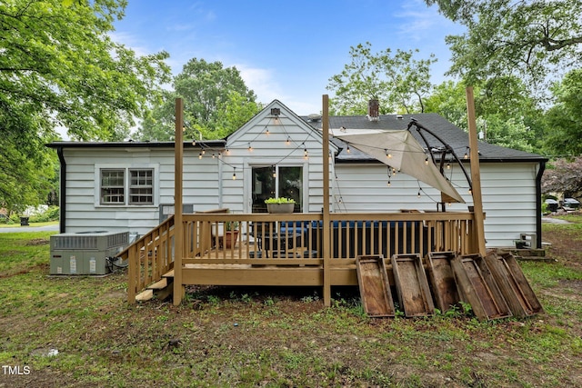 1105 Hawthorne Ln, Burlington, NC 27215 - rear view of house with cooling unit, a deck, and a chimney