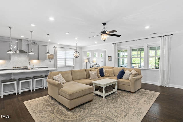 1002 Gilly Ct, Durham, NC 27703 - living room with a ceiling fan, recessed lighting, dark wood-style floors, baseboards, and ornamental molding