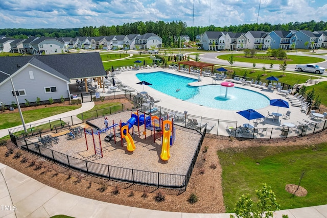 279 Edge Of Auburn Blvd, Raleigh, NC 27610 - view of swimming pool featuring a residential view and a water play area